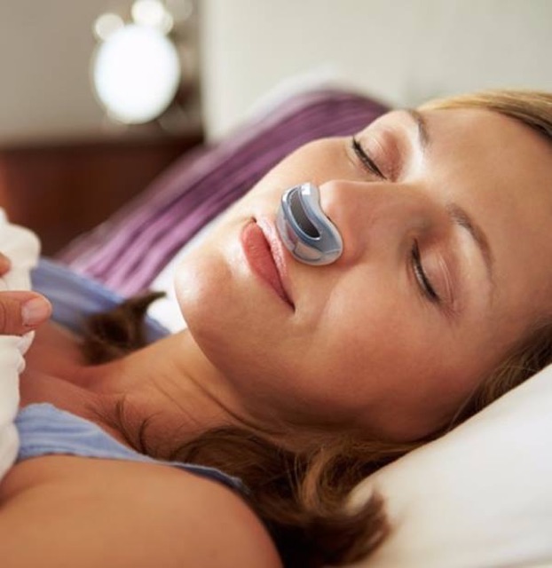 Guy on a bike ok a wooden bridge with a forest backdrop